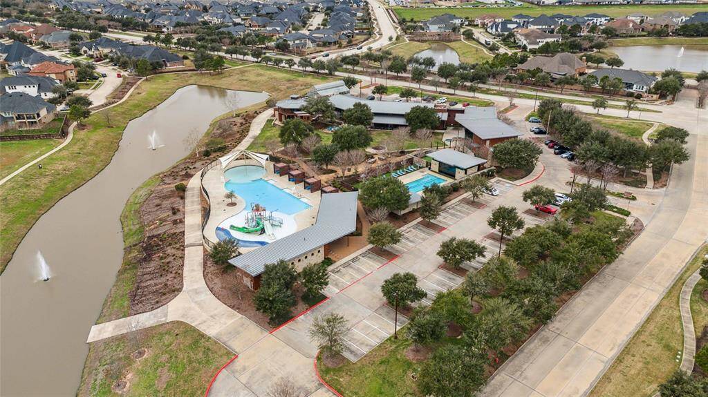 Amenity center with on-site restaurant, fitness center, lap pool, splash pad and resort style pool.