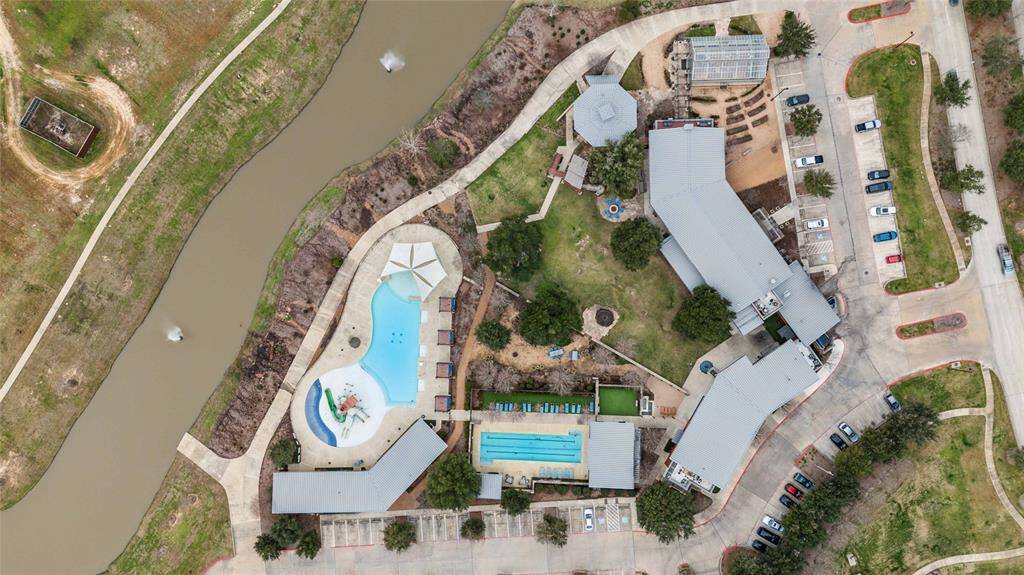 Amenity center with on-site restaurant, fitness center, lap pool, splash pad and resort style pool.