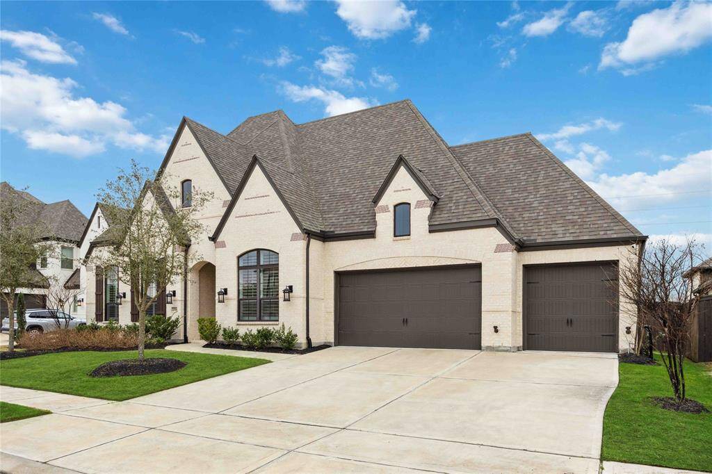 Gorgeous exterior with a 4 car garage