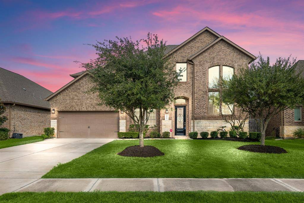 Welcome home to 28926 Endeavor River Road located on a quiet street in Tamarron and zoned to Lamar Consolidated ISD! This stunning home has lovely curb appeal, a well-manicured lawn, beautiful landscaping, stone/brick elevation, dark stained front door with glass detailing, covered front porch, traditional style, beautiful outdoor lanterns and a double wide driveway!