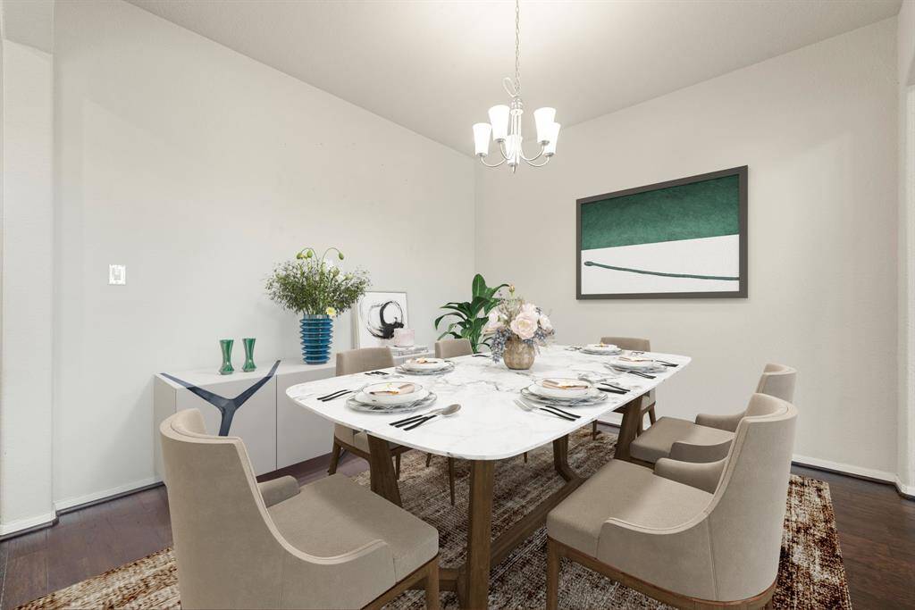 You and your guests will certainly dine in style in this amazing dining room! Featuring a gorgeous modern chandelier, neutral paint, high ceilings, and wood flooring. Perfect space to entertain family and friends.