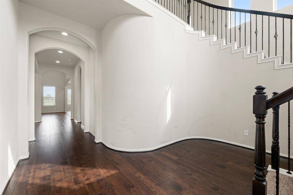 Walking into this gorgeous home, you get a feel of just how grand everything is, this space showcases soaring high ceilings, beautiful archways, curved staircase, open space and a fluid floor plan.