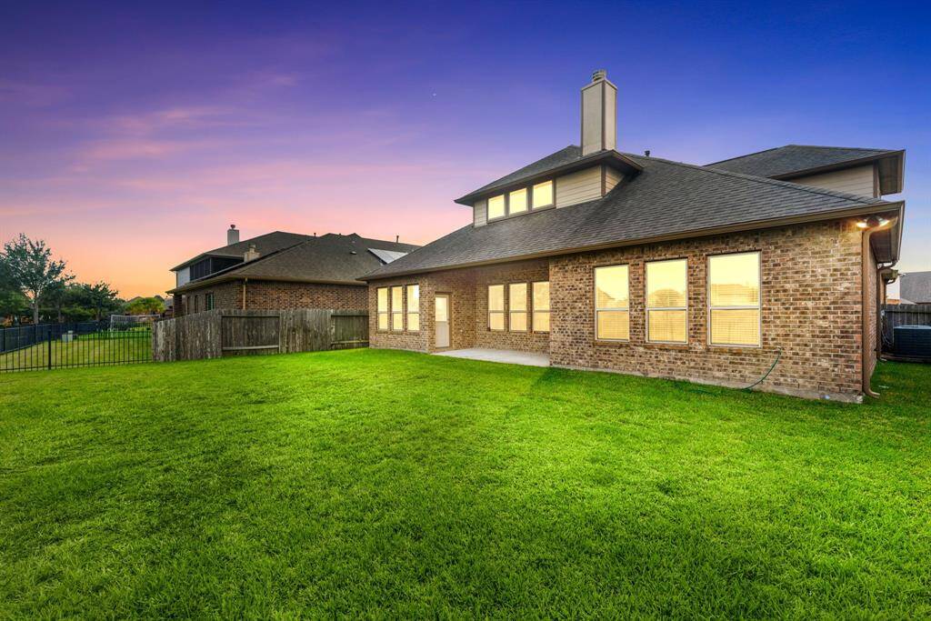 Come and see this spacious backyard with its beautiful covered patio. There is plenty of room for the kids to play and adults to relax! Perfect for your outdoor living space, patio furniture, bbq pit, and so much more. The possibilities are endless!