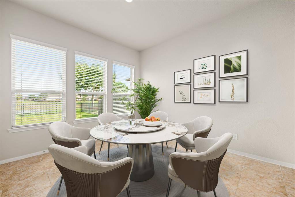 Start your day off right with a cup of coffee sitting with your family in the lovely breakfast area! Featuring large windows with blinds, neutral paint, tile flooring, recessed lighting and high ceilings.