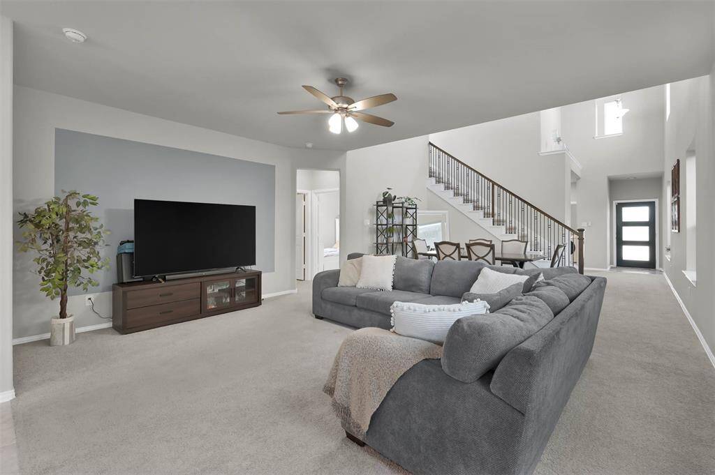 The layout flows into a dining area, making it ideal for entertaining