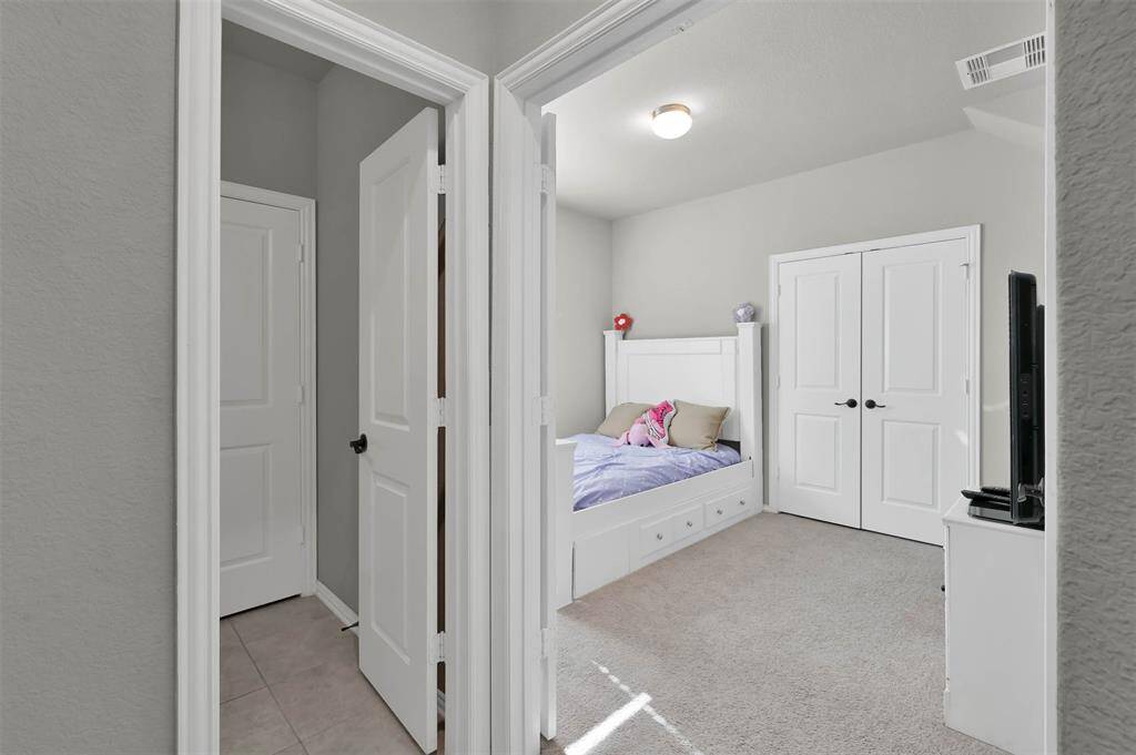 Additional BR downstairs perfect for a guest suite or home office leading from the livingroom & also features half bathroom
