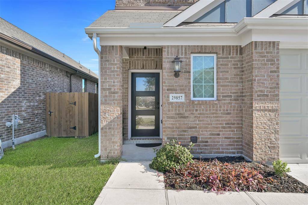 Inviting covered entryway featuring small porch