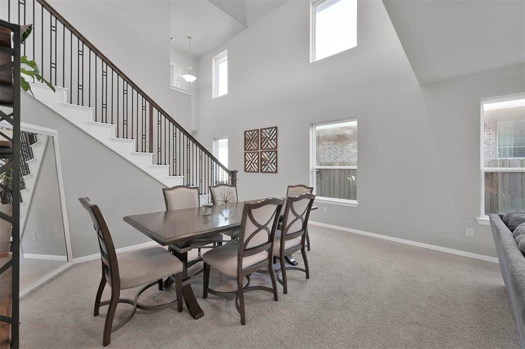Features a modern staircase with a sleek railing