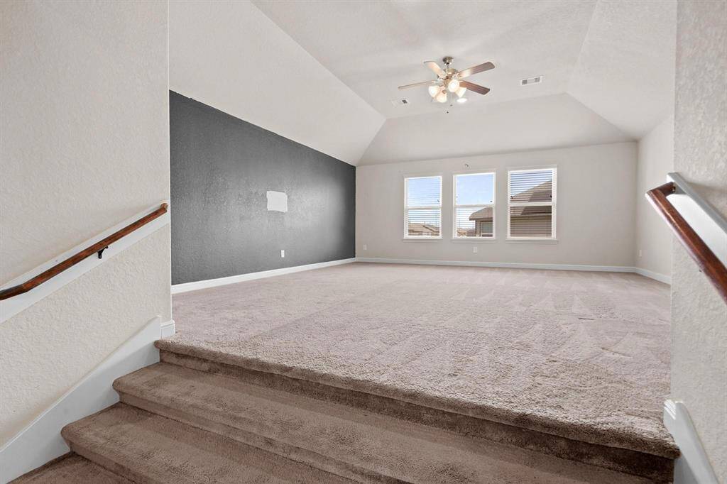 Step up into the oversized gameroom. Perfect for kids or for a pool table.