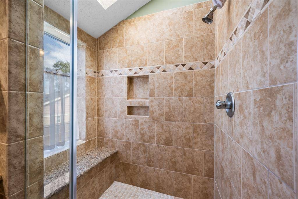 Custom walkin shower with glass shower door