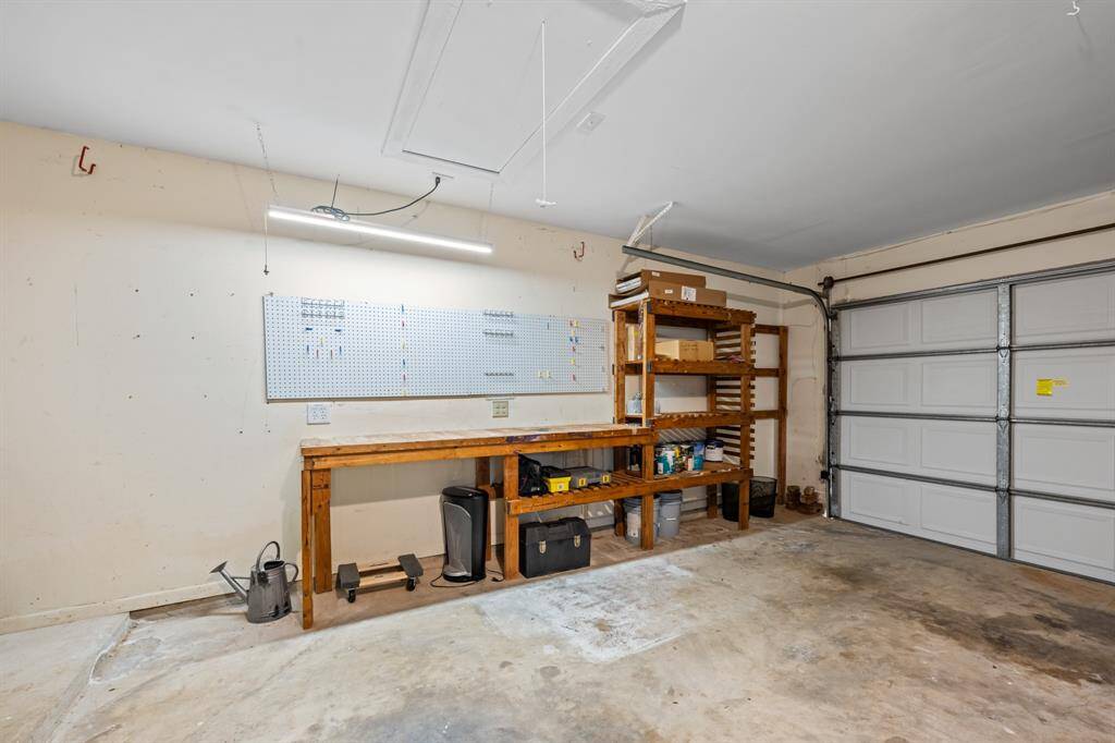 Garage with workbensh and axtra shelving