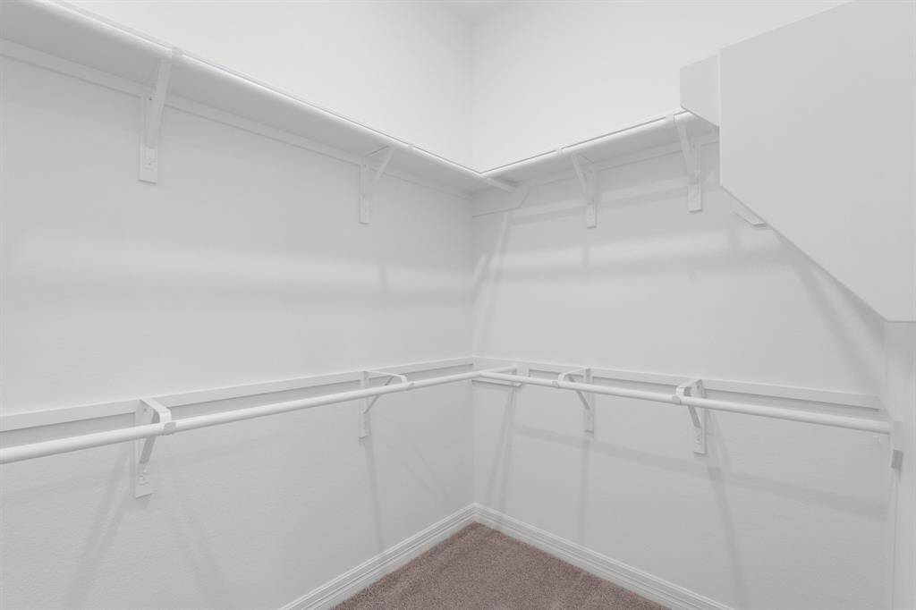 A view of your large primary walk-in Closet