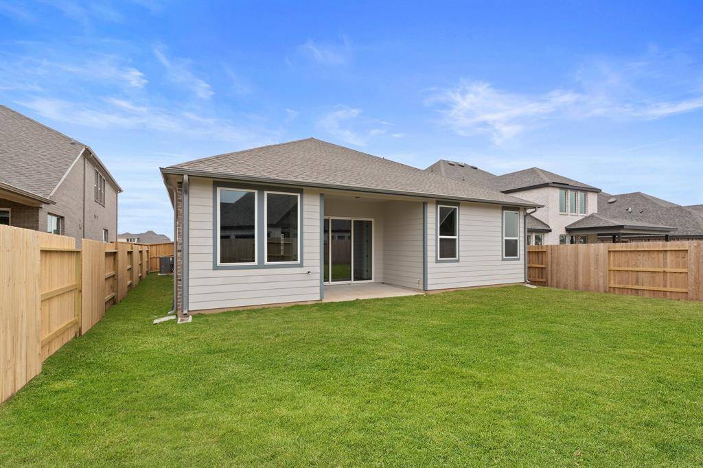 This backyard is perfect for family gatherings, social events, or simply unwinding in the fresh air.