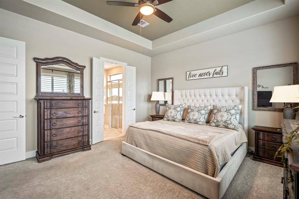 Come and unwind after a long day in this magnificent primary suite! This spacious room features high ceilings, upgraded carpet, ceiling fan, and an ensuite bathroom!