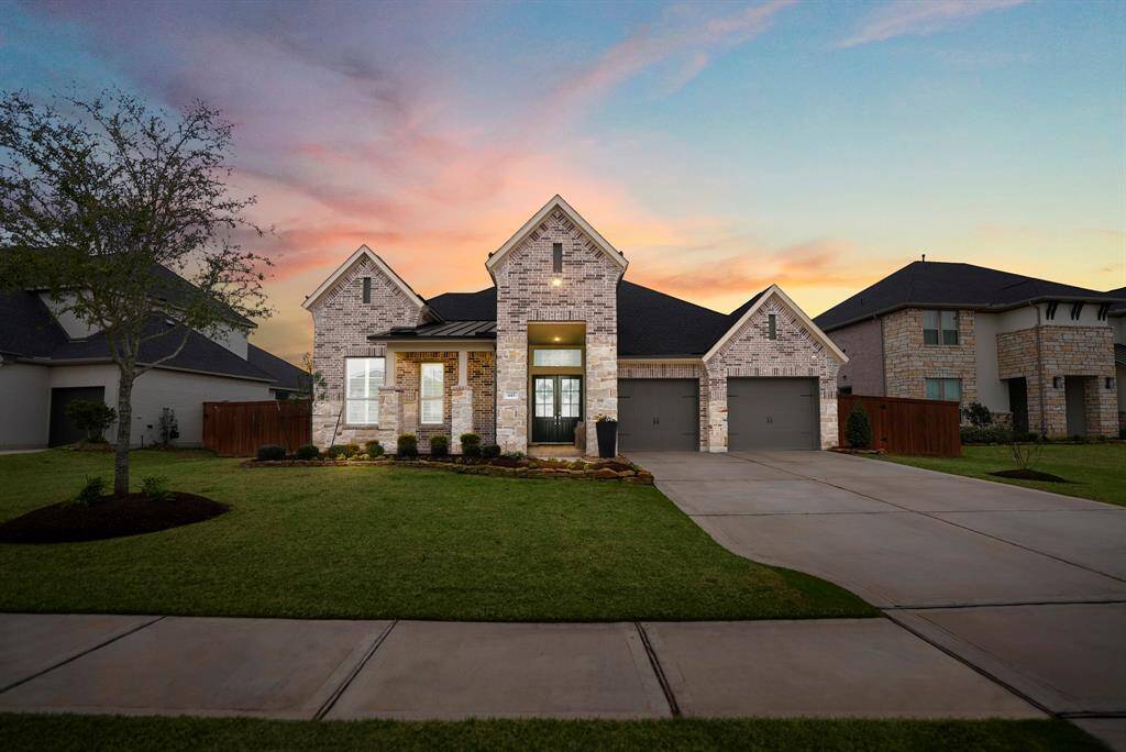 Welcome home! Recently built, this beautiful 1 story home greets you with a warm brick and stone exterior, large front porch, and lush landscaping! Sellers own a custom closet company, every closet in the home has been customized to maximize storage! Garage includes top of the line storage equipment that will convey with the home.