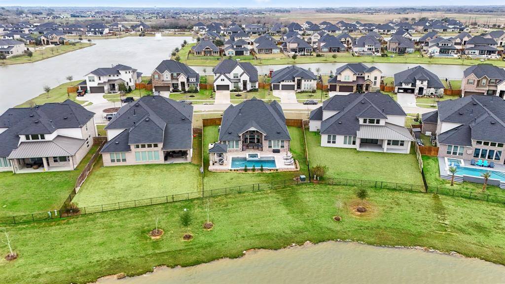 This home boasts breathtaking water views, a sparkling pool & spa, two covered patios, a cozy outdoor fireplace, and quiet cul-de-sac street—your private oasis awaits!