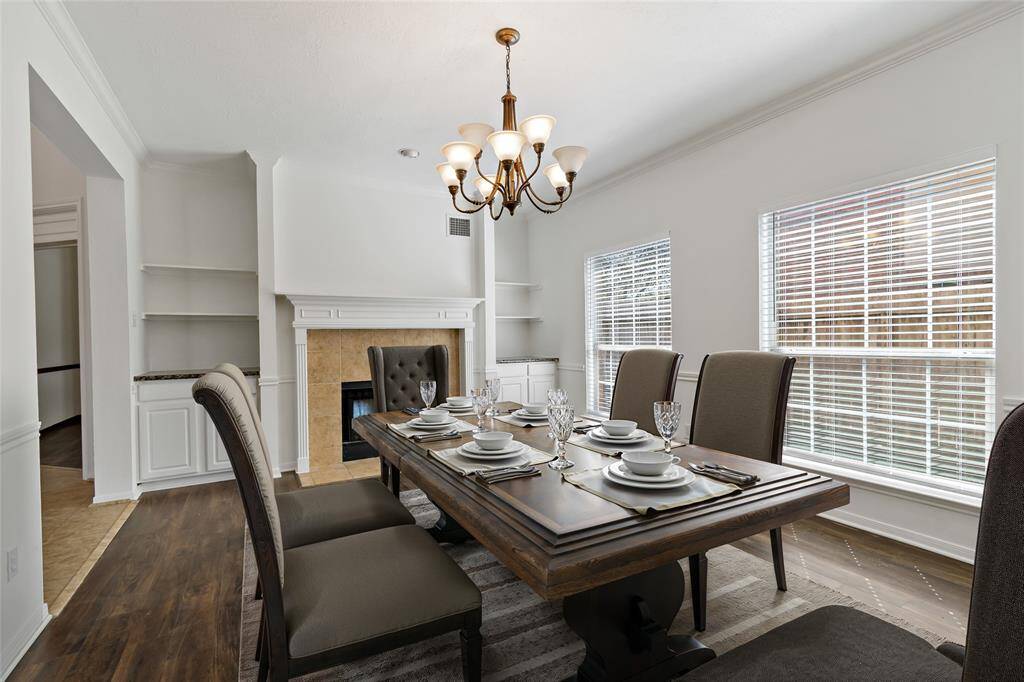 Cozy dining room with a charming fireplace.