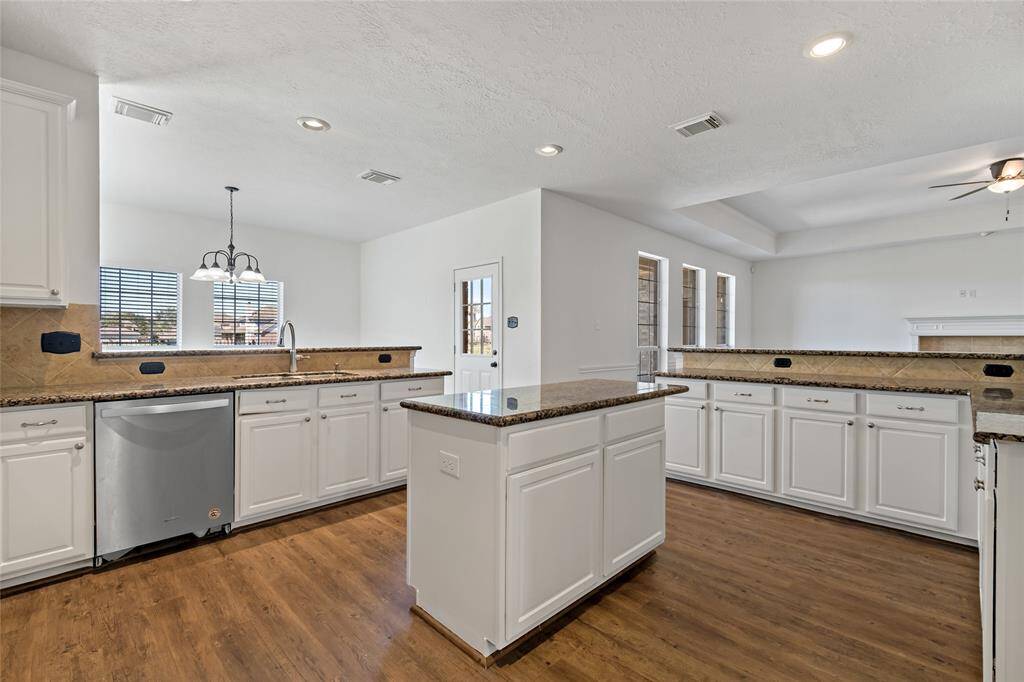 Bright and inviting island kitchen with fresh paint, perfect for modern living.