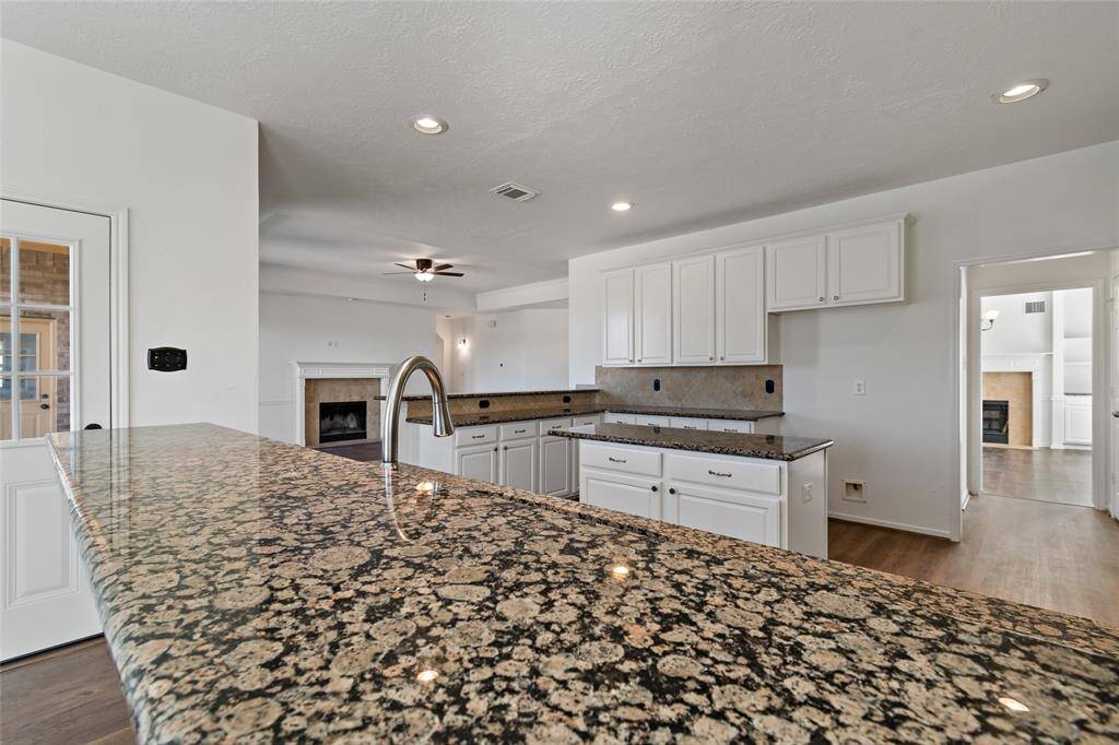 Convenient powder room located near the entry and family room for easy access.