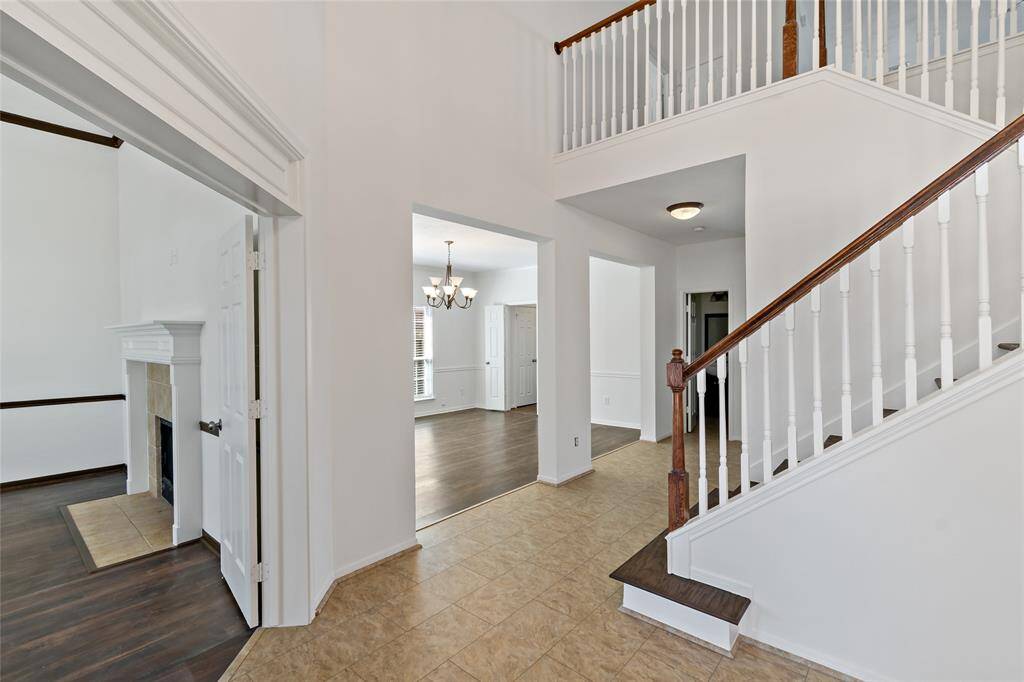 Welcome to your new home through a stunning grand entry, featuring soaring ceilings and elegant architectural details.
