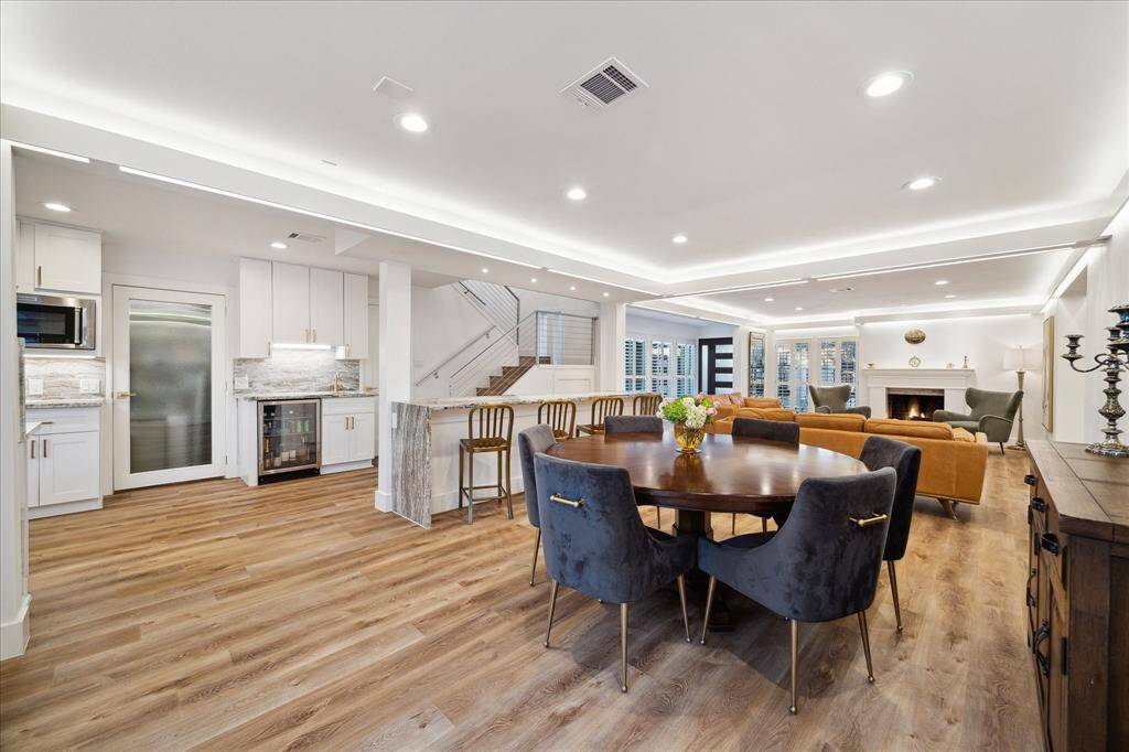 This elegant open dining room is the perfect space to host lavish dinner parties and casual gatherings. Your friends and family are going to love breaking bread with you in this beautiful space.