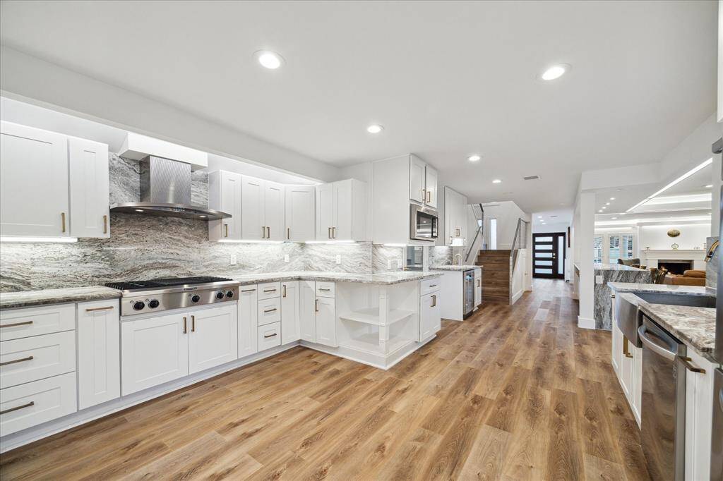 This spectacular kitchen features ample countertop space, abundant cabinetry, sleek stainless-steel appliances, and a spacious pantry. With plenty of room for your sous chef and cleanup crew, you can skip the takeout and experience the joy of cooking at home!