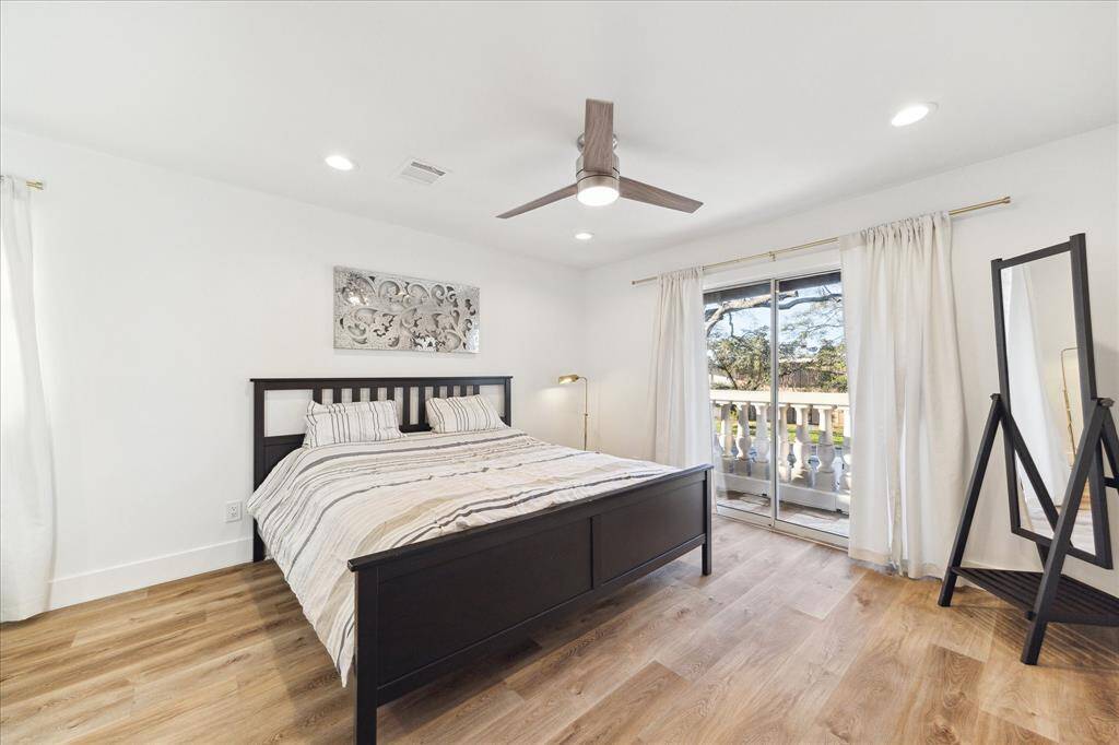 You'll have sweet dreams in this posh retreat with luxurious vinyl plank flooring, updated lighting, neutral paint, glass doors that open to a balcony, a large walk-in closet and a gorgeous ensuite bathroom.