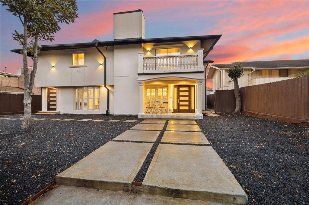 Nestled on a quiet cul-de-sac, this stunning home offers enhanced privacy with a sleek privacy wall featuring iron accents and modern lighting. A covered front porch provides a warm welcome, while the two-car garage with alley entry ensures convenience and ample off-street parking.