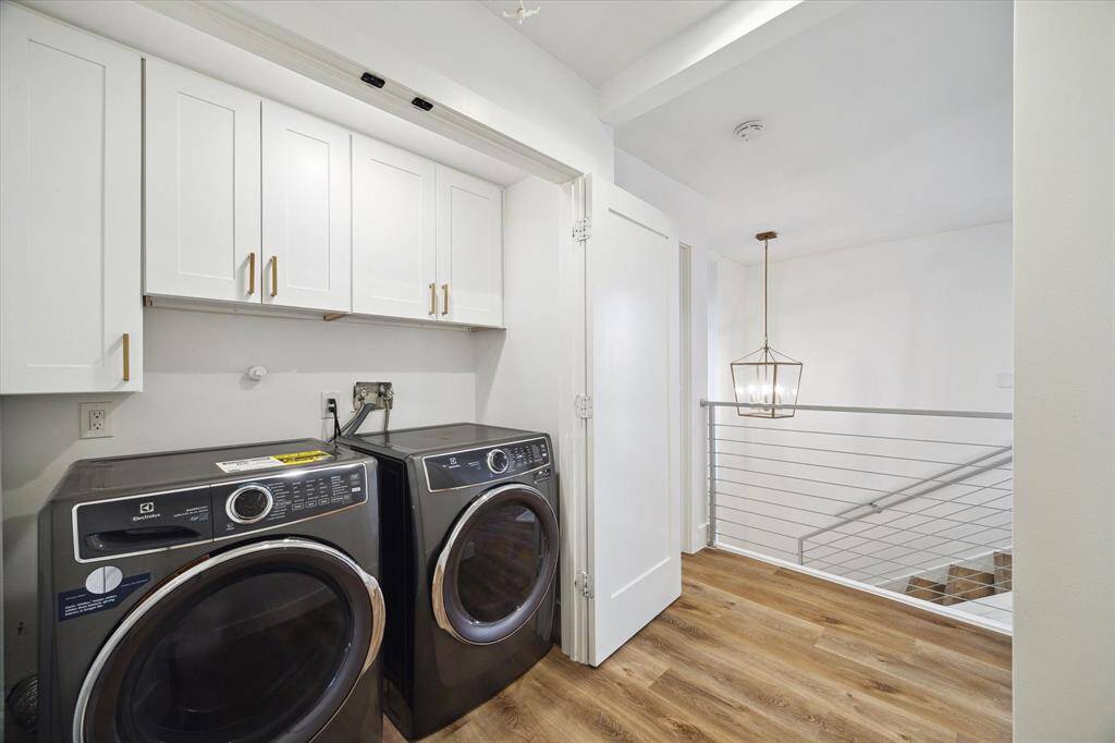 Enjoy the convenience of a second-floor utility room with built-in storage, LVP flooring, and washer/dryer hookup.