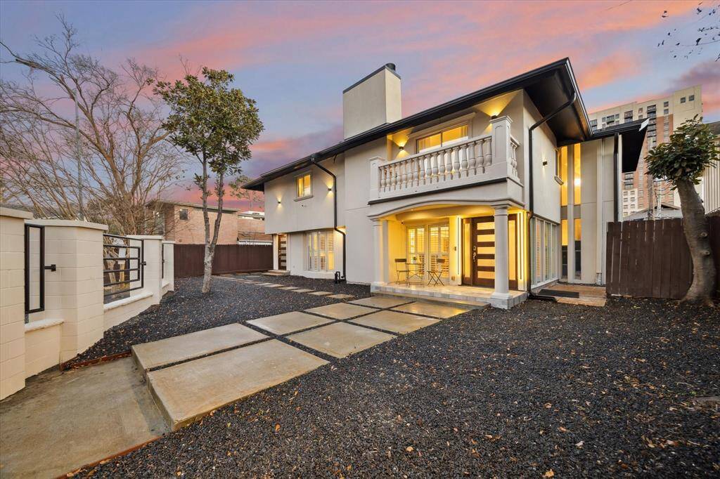 This home features a beautifully designed low-maintenance yard with a durable rock base with French drains ensuring easy upkeep year-round.