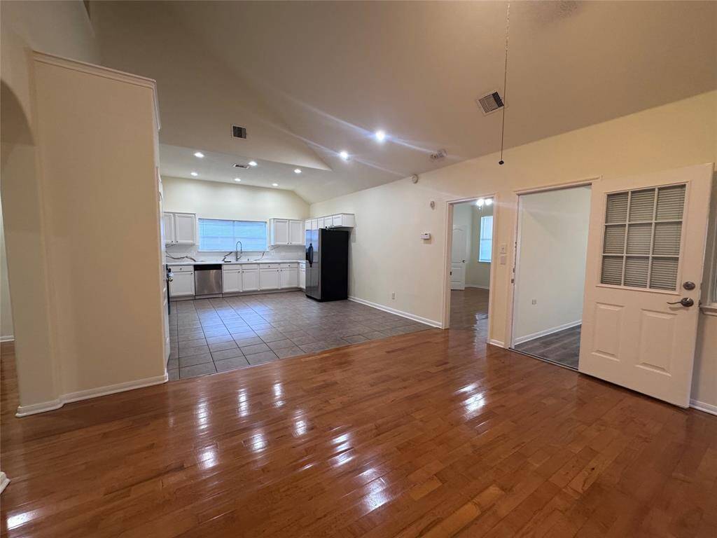 Open concept between living room and kitchen area