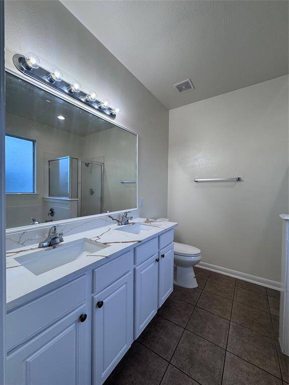 Double vanity sink with separate standing shower and tub