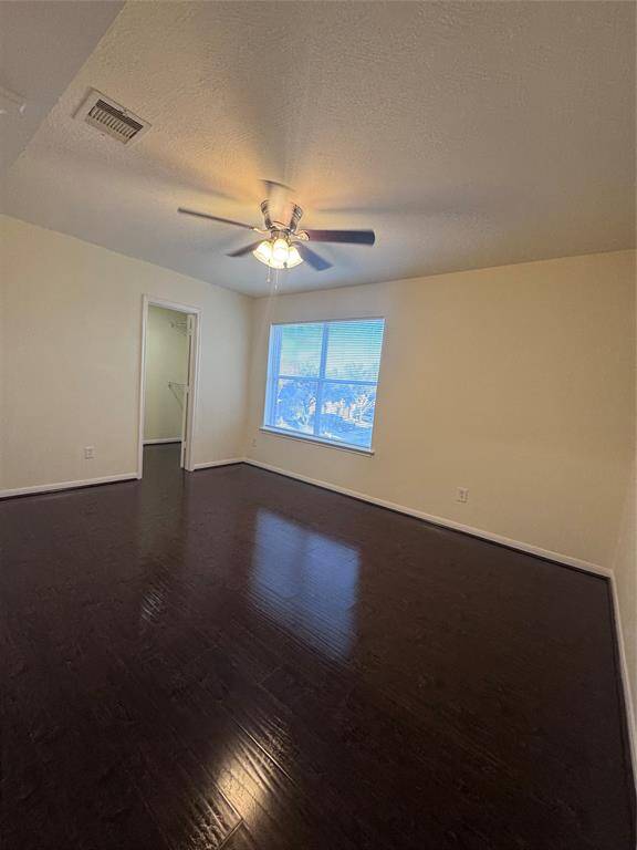 Secondary bedroom upstairs with ceiling fan