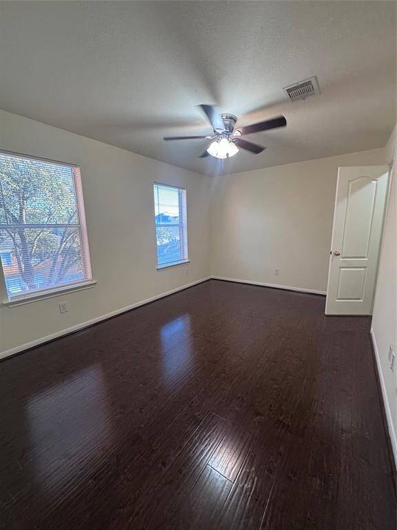 Secondary bedroom upstairs with ceiling fan