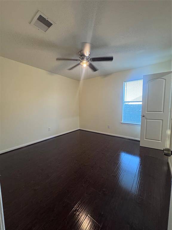 Secondary bedroom upstairs with ceiling fan