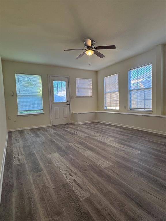 Bonus room/sun room with fan and window unit.