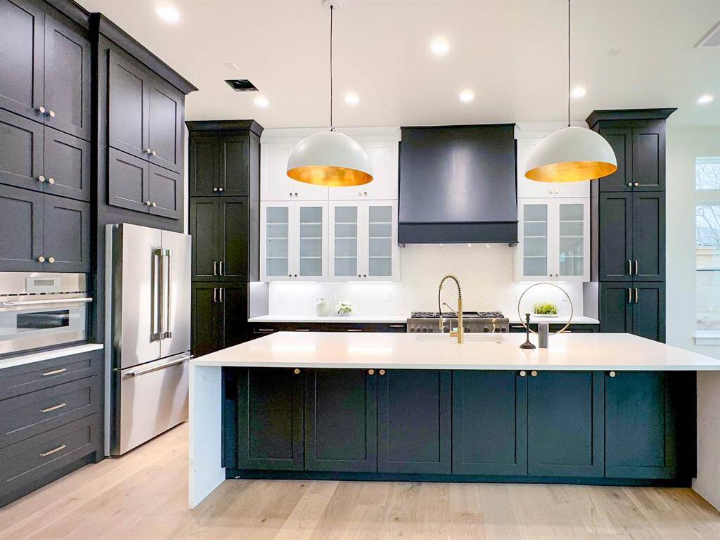 Large kitchen with quartz countertops