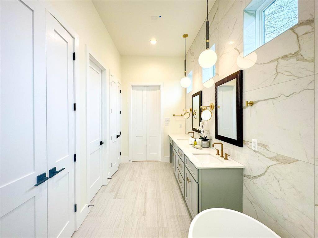 Tub and standing shower inside master bathroom