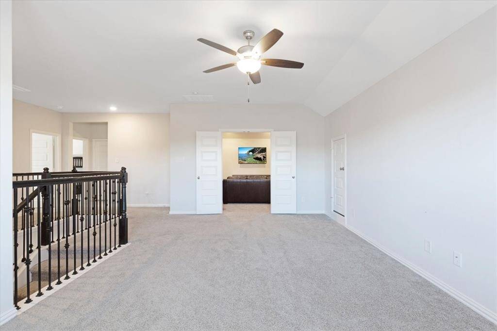 Huge upstairs game-room that leads into the media room perfect for family or entertaining