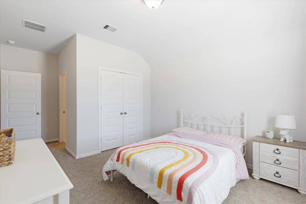 One of the upstairs bedrooms. This room has a full ensuite bathroom