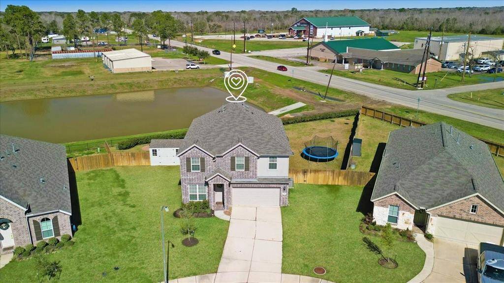 The large and nearly new shed to the left stays with the home!