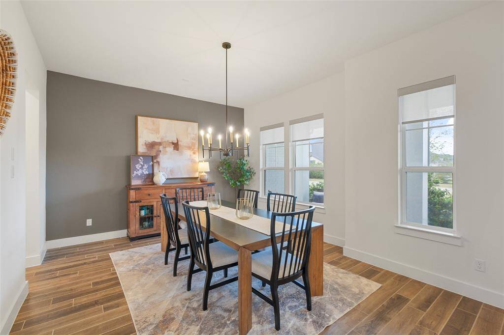 The study is to the left of the entry with privacy glass doors. This room is prewired for wall mounted televisions, and has remote controlled window shades.