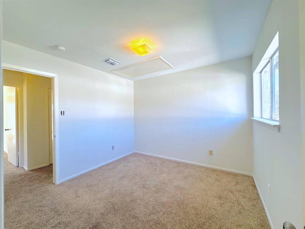 A cozy and inviting bedroom with ample natural light, perfect for relaxation and restful nights.
