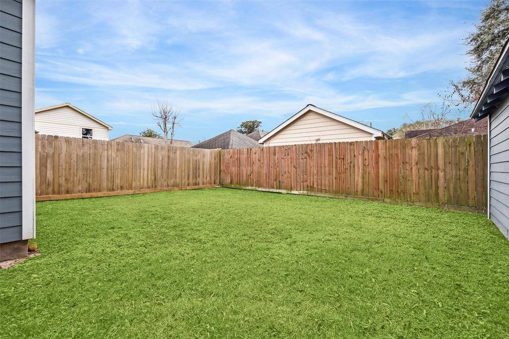 This charming cottage features a well-maintained front yard, gated driveway, and mature trees. Ideal for those seeking a welcoming and private home environment.