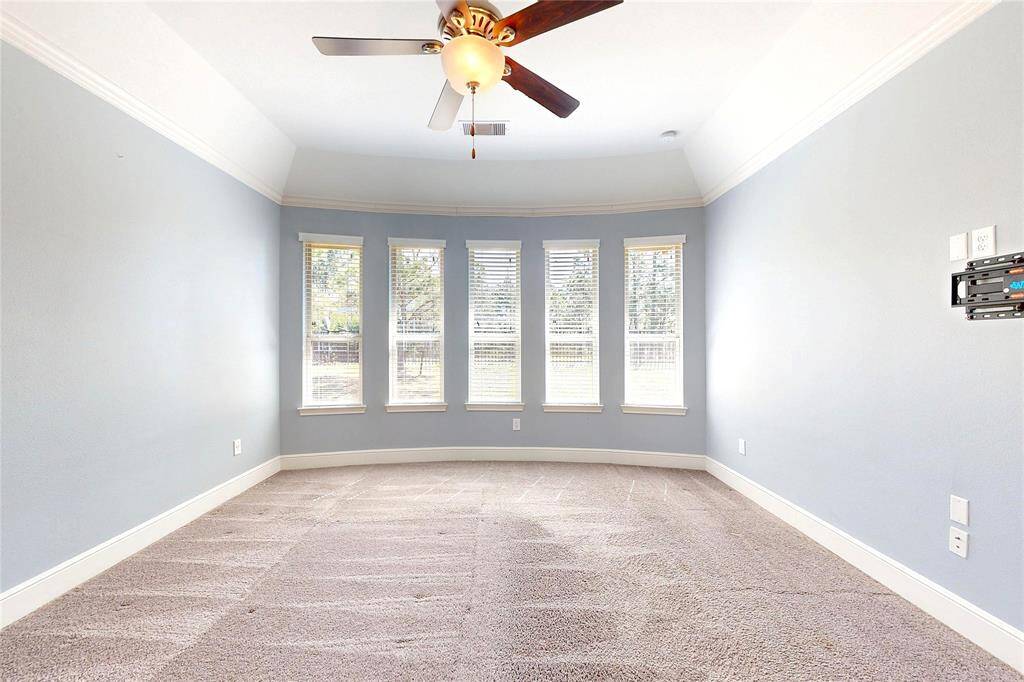 Master bedroom with natural light and crown molding!