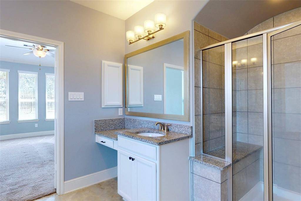 Dual sinks and vanity w/ walk-in shower!