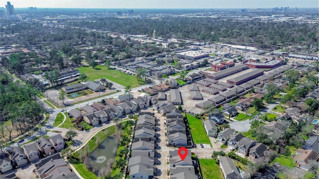 A much higher vantage point showcases the surrounding community. The location offers a blend of suburban comfort and city accessibility, making it a prime spot to call home.