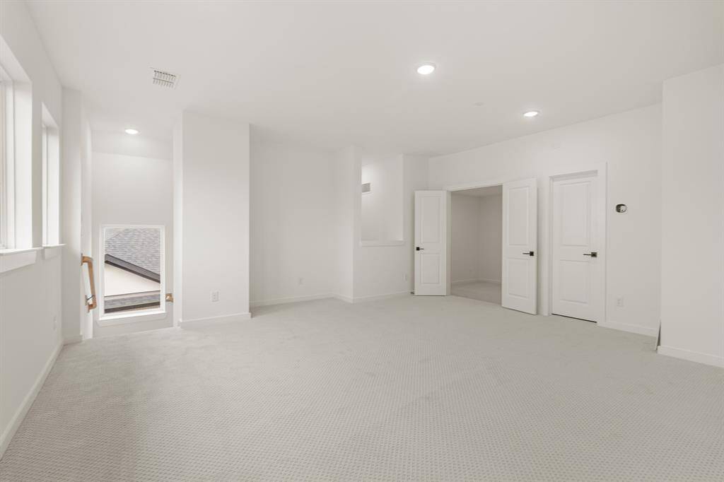 HUGE GAME ROOM UPSTAIRS - LOTS OF WINDOWS TO BRING IN LIGHT - UPGRADED STYLISH CARPET -- PLENTY OF ROOM FOR A POOL TABLE AND TO HANG OUT AND RELAX