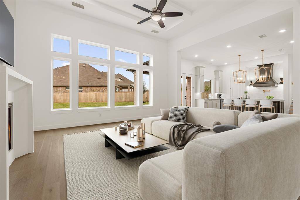 STUNNING SPACIOUS FORMAL DINING TO ENTERTAIN IN STYLE - VIEWS INTO COURTYARD - WARM TONED WOOD FLOORING THROUGHOUT