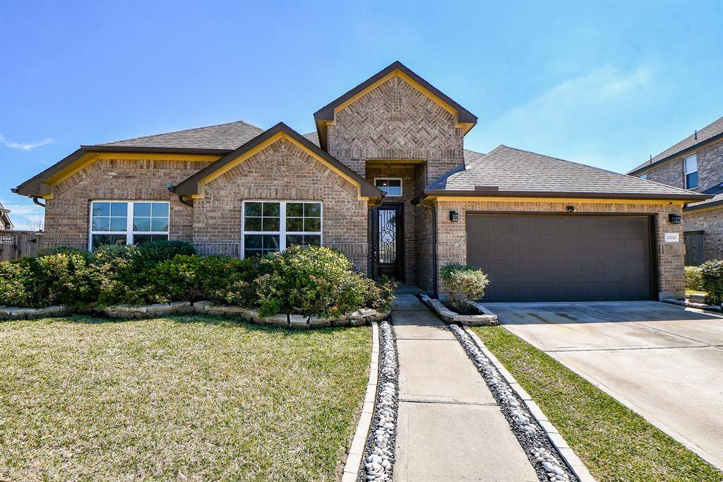 Upgraded inviting stone path leads you to the front door